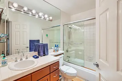 a bathroom with a sink and a shower and a toilet at Ocean-View Imperial Beach Condo with Community Perks in Imperial Beach
