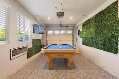 a pool table in a room with green walls at San Diego Chill House with Jacuzzi-Golf-Game Room in San Diego
