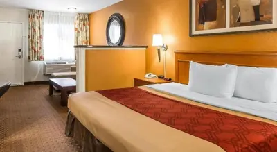 a hotel room with a large bed in a room at El Cajon San Diego East in El Cajon