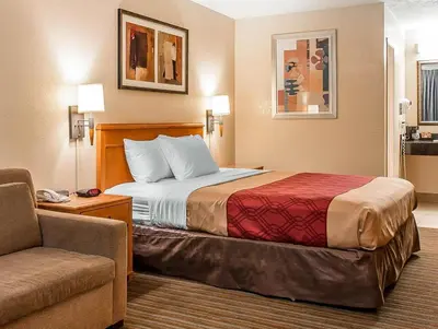 a hotel room with a bed and a couch at El Cajon San Diego East in El Cajon