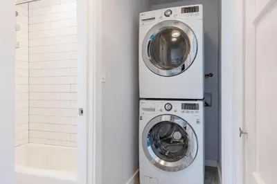 a laundry room with a washer and dryer at Walk to Beach, Outdoor Living, Pet-Friendly! in Carlsbad