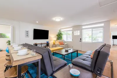 a living room with a couch and a table at CBS-1236 - Sensational Summit Sunsets in Cardiff-by-the-Sea