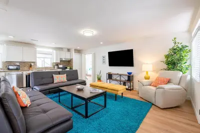 a living room with a couch and a table at CBS-1236 - Sensational Summit Sunsets in Cardiff-by-the-Sea
