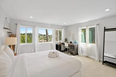 a white bedroom with a white bed and a desk at Executive Retreat - Renovated - Spacious - Views in La Mesa