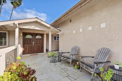 two chairs on a patio in front of a house at Executive Retreat - Renovated - Spacious - Views in La Mesa