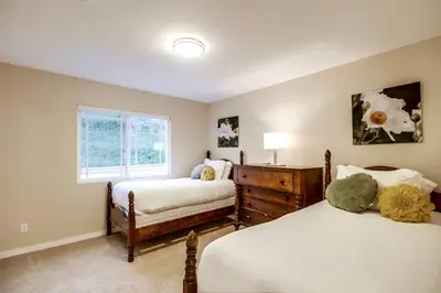 a bedroom with two beds and a window at Villa Solamar-Sunset Cliffs Spectacular in San Diego