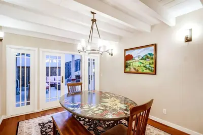 a dining room with a glass table and chairs at Villa Solamar-Sunset Cliffs Spectacular in San Diego