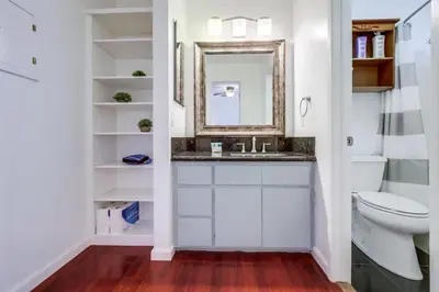 a bathroom with a sink and a mirror at Steps to Restaurants Beach Bay Park Bars in San Diego