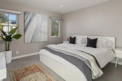 a white bedroom with a large bed and a window at Cypress Cabana Chateau Luxury Vacation Villa in San Diego