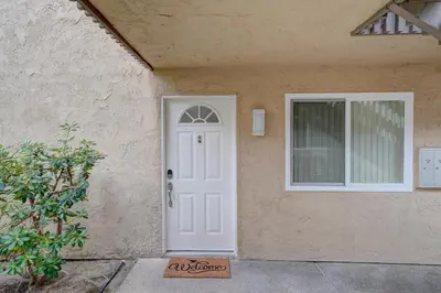 a white door and a window on a house at 3 Mi to La Jolla Shores Relaxing Resort Retreat! in San Diego