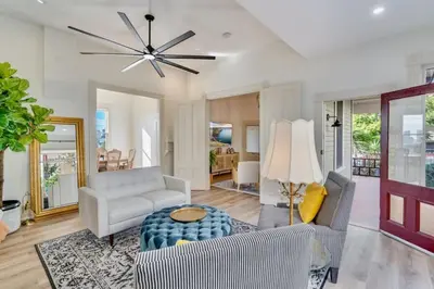 a living room with a couch and a table at The Stanton Residence - Chic and Cozy Classic near Downtown in San Diego