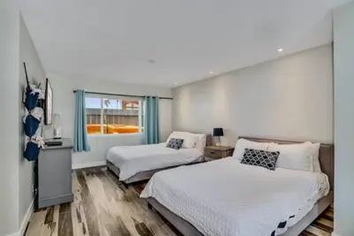 a bedroom with two beds and a window at Sea house at Sea shore - 4 bedroom 3 bath - 14 ppl in San Diego