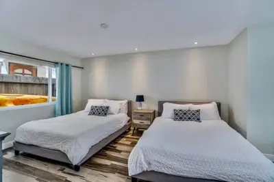 a bedroom with two beds and a window at Sea house at Sea shore - 4 bedroom 3 bath - 14 ppl in San Diego