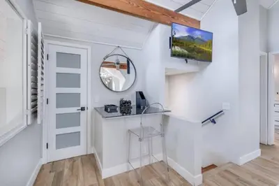 a white room with a table and a mirror at Sea house at Sea shore - 4 bedroom 3 bath - 14 ppl in San Diego