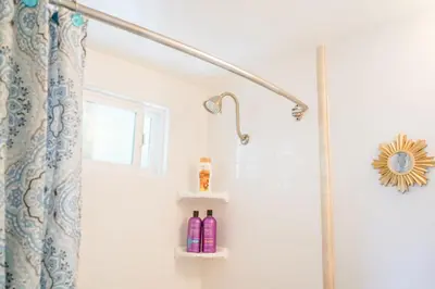 a shower in a bathroom with a shower curtain at STUNNINGLY PERFECT Beach ALL NEW REMODEL Galore in Laguna Beach