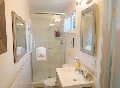a bathroom with a shower and a sink and a toilet at STUNNINGLY PERFECT Beach ALL NEW REMODEL Galore in Laguna Beach