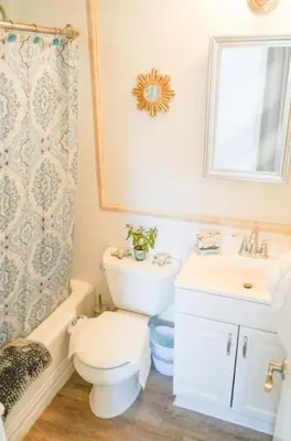 a bathroom with a toilet and a sink at STUNNINGLY PERFECT Beach ALL NEW REMODEL Galore in Laguna Beach