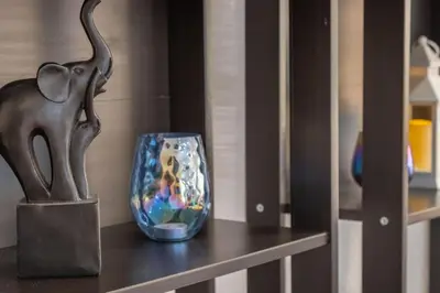 a vase sitting on a shelf next to a statue at Stunning huge one level 1350 ft. cottage in Mission Viejo