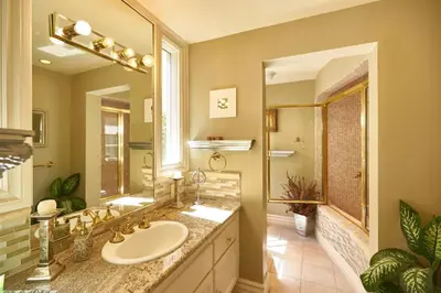 a bathroom with a sink and a large mirror at UNEQUALLED LUXURY VILLA BEACH 7000ft 180 VIEW in Laguna Beach