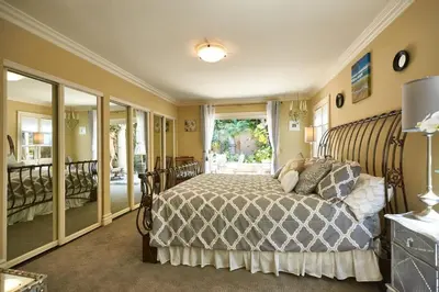 a bedroom with a bed and a window at UNEQUALLED LUXURY VILLA BEACH 7000ft 180 VIEW in Laguna Beach
