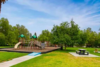 a park with a playground with a slide at Glamorous Regal Design Home with Private Patio and Garage in Laguna Hills