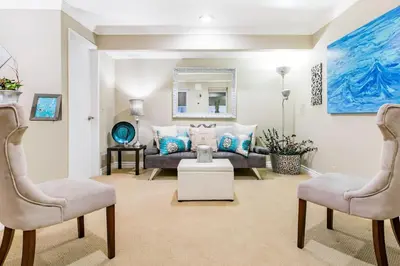 a living room with a couch and two chairs at Unparalleled Villa Apartment in an Enchanting Village in Laguna Beach