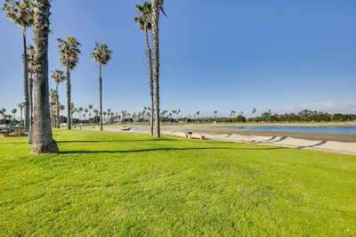 a park with palm trees and a beach at Updated Mission Beach Condo Walk to Belmont Park! in San Diego