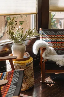 a room with a chair and a vase with a plant at Balboa 6BR Mansion with Hot Tub and Game Room in San Diego
