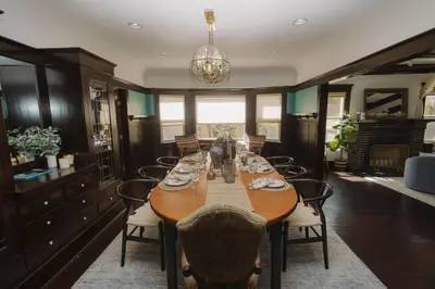 a dining room with a wooden table and chairs at Balboa 6BR Mansion with Hot Tub and Game Room in San Diego