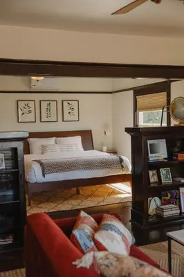 a living room with a bed and a couch at Balboa 6BR Mansion with Hot Tub and Game Room in San Diego