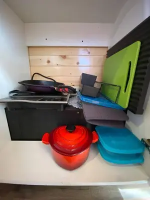 a toy kitchen with a red fire hydrant on a counter at Tiny House - mountain views close to everything in Valley Center