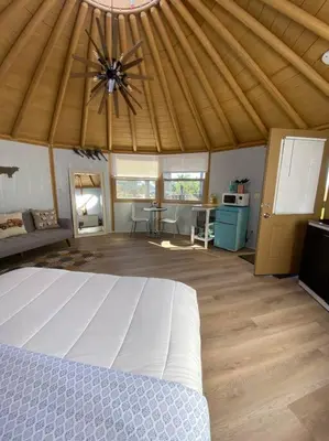 a bedroom with a white bed in a tent at Glamping-Sky Dome Yurt-Tiny House-2 modern composting toilet in Valley Center