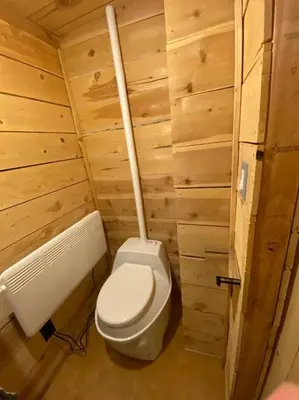 a small bathroom with a toilet and a radiator at Glamping-Sky Dome Yurt-Tiny House-2 modern composting toilet in Valley Center