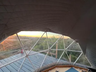 a view from the top of a building with a roof at Sunset Dome - Outdoor Shower/Composting Toilet in Valley Center