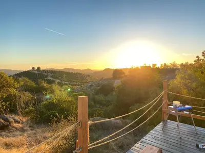 a view of the mountains with the sun setting at Sunset Dome - Outdoor Shower/Composting Toilet in Valley Center