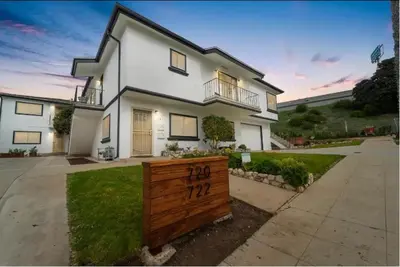 a white house with a wooden fence in front of it at Perla D'Italia -1BR- FREE Driveway Parking -1 Car in San Diego
