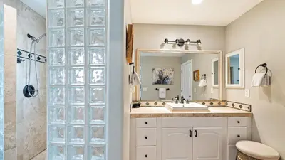 a bathroom with a sink and a mirror at Breathtaking Meadows by AvantStay Temecula Group Retreat Pool Pickleball Firepit Hot Tub in Temecula