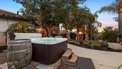 a hot tub in the backyard of a house at Breathtaking Meadows by AvantStay Temecula Group Retreat Pool Pickleball Firepit Hot Tub in Temecula