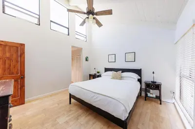a bedroom with a bed and a ceiling fan at SB-6758 - Italian Coastal Getaway in Solana Beach