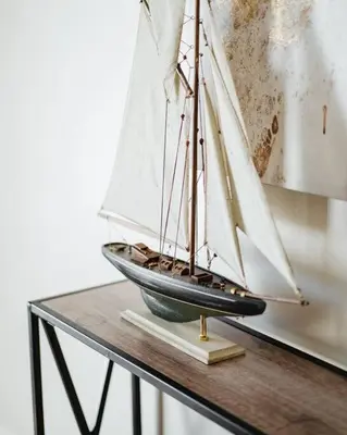a model boat sitting on top of a table at Casa Flora -2BR- FREE Parking in Little Italy! in San Diego