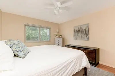 a bedroom with a white bed and a ceiling fan at Casa Amore -2BR- FREE Driveway parking for 3 cars in San Diego