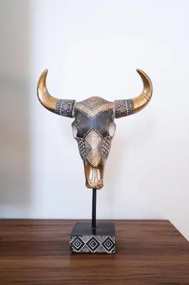 a figurine of a bull with horns on a stand at * Bueno Bueno Casita * / 7 min to Downtown / 4 Bdr in San Diego