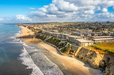 an aerial view of a beach and buildings at Del Mar Gem condo in Solana Beach