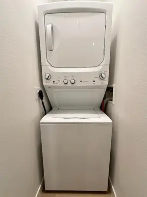 a washer and dryer sitting on top of a toilet at Nimitz Crossing Luxury Residences in San Diego