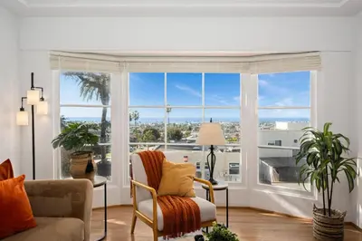 a living room with a large window at Sea Side Beauty in San Diego
