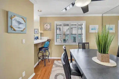 a dining room with a table and chairs at Pine Street #2 in Oceanside