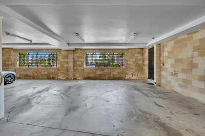 an empty garage with a car parked in it at Pine Street #2 in Oceanside