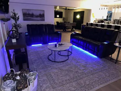 a living room with a couch and a table at Luxury Resort•POOL/SPA/Golf/Grill/Games/Sleep 40+ in Lakeside