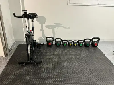 a bike parked next to a row of exercise balls at Luxury Resort•POOL/SPA/Golf/Grill/Games/Sleep 40+ in Lakeside