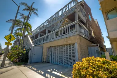 a building with a balcony on top of it at Oceanfront 1BR, Fully Furnished, Gated Parking in Oceanside